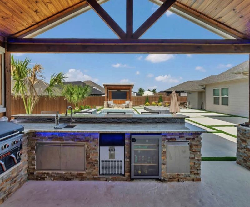 Poolside stone kitchen with counter seating