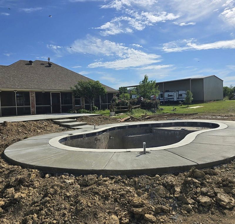 Gunite shell with coping set and deck poured